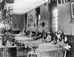 view Hahnemann Hospital and Homœopathic Dispensaries, Liverpool: a women's ward, decorated with flags possibly for the coronation of King George V. Photograph.