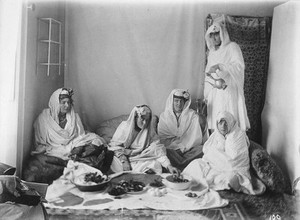 view Ladies of the royal harem enjoying an Afghan meal. Kabul