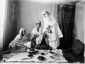 view Ladies of the royal harem enjoying an Afghan meal. Kabul