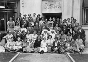 view Birmingham Hospital Saturday Fund Convalescent Home, Kewstoke, Weston-super-Mare: nurses (?) outside the patients' entrance. Photograph by R.W. Brown & Son, 1936.