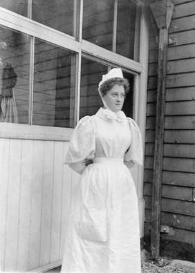 A nurse and a smallpox patient in an isolation hospital, possibly at Ilford, Essex. Three photographs.