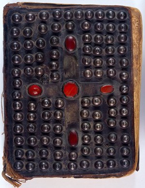 view The Four Gospels, 1495, dark brown leather over boards with silver ornaments and a cross studded with five comelian stones