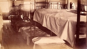 view Bellevue Hospital, New York City: a dormitory with bunk beds. Photograph.