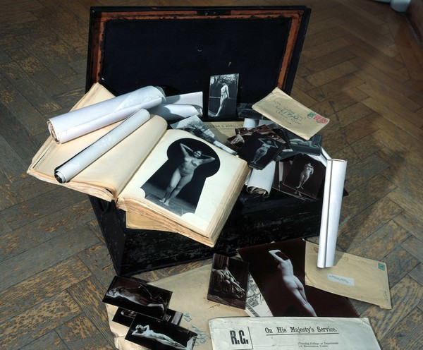 A metal and timber box (chest, trunk), once the property of E N Fallaize, used to house his photographic collection. Construction and assembly by H. Davies and sons, 1916.