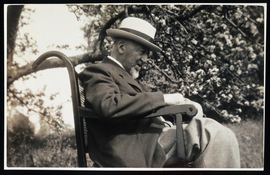 Sir Henry Head sitting in chair in garden
