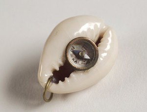 view Compass encased within a shell, good luck charm