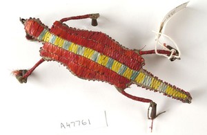 view Sioux Indian amulet in the form of a turtle, worn by girls to ward off illness. Said to contain the umbilical cord of the wearer. Decorated in quills. Northern Plains