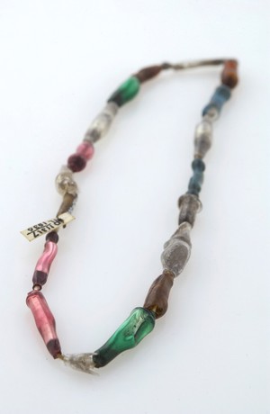 view An amuletic necklace worn to cure sore throats, London.