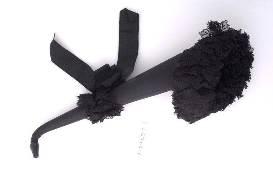 A Victorian ear trumpet swathed in black silk and lace mouning