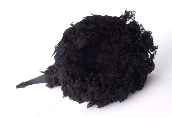 A Victorian ear trumpet swathed in black silk and lace mouning