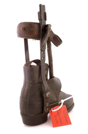 A Victorian child's shoe and leg caliper in leather and steel