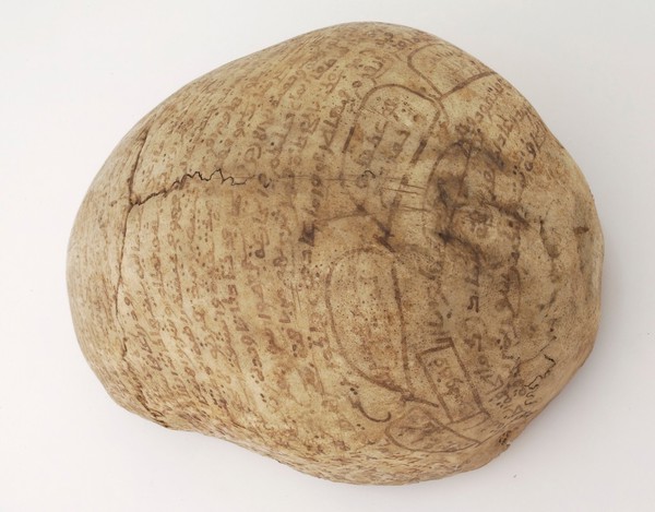Human skull inscribed with prayers for the deceased. Collected by Robert Baden Powell's Asante (Ghana) expedition 1895