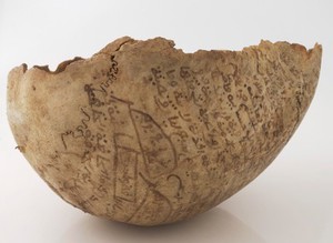 view Human skull inscribed with prayers for the deceased. Collected by Robert Baden Powell's Asante (Ghana) expedition 1895