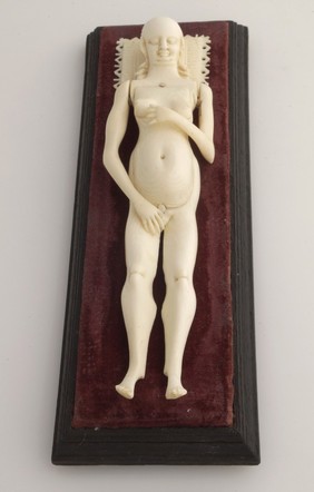 Ivory anatomical model of a pregnant female with removable parts possibly used by obstetric specialists or midwives to provide reassurance for pregnant women. Possibly German