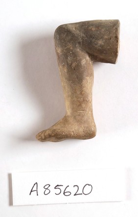 A clay-backed leg and foot. Roman votive offering
