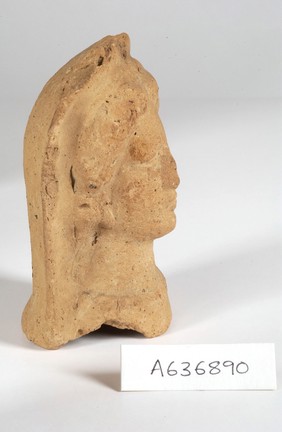 A clay-baked face. Roman votive offering