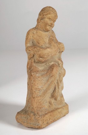 A clay-baked mother and child. Roman votive offering