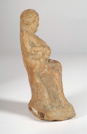 A clay-baked mother and child. Roman votive offering