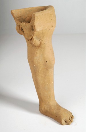 view A clay-baked leg. Roman votive offering