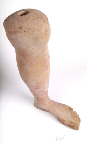 A clay-backed leg and foot. Roman votive offering