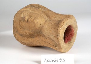 view A clay-bakedface. Roman votive offering