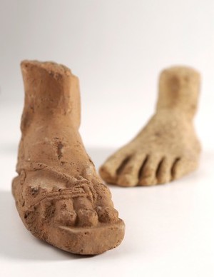 view Two clay-baked feet. Roman votive offering