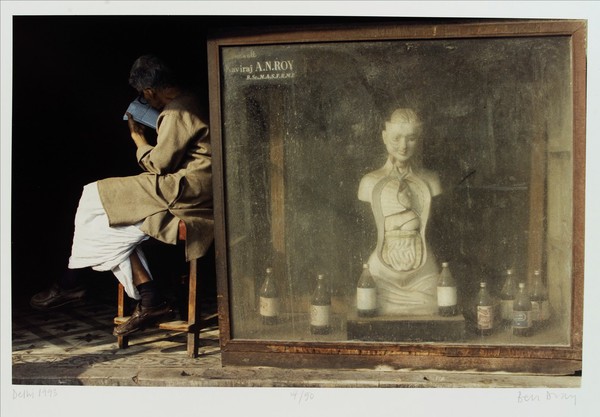 Delhi: an anatomical model advertising a pharmacy. Colour photograph by Ben Dray, 1993.