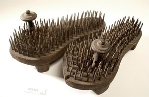 view A pair of fakir's sandals with iron spikes.