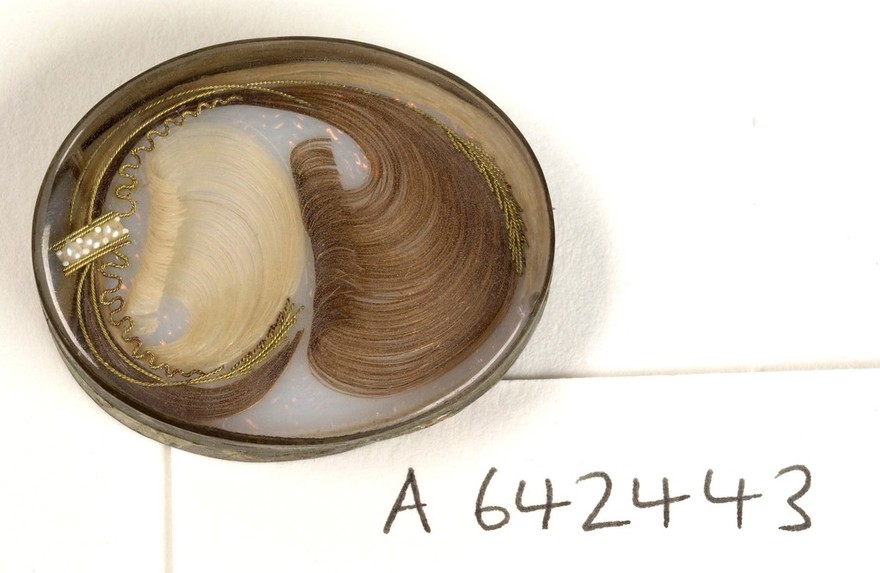 Mourning brooche containing the hair of a deceased relative.