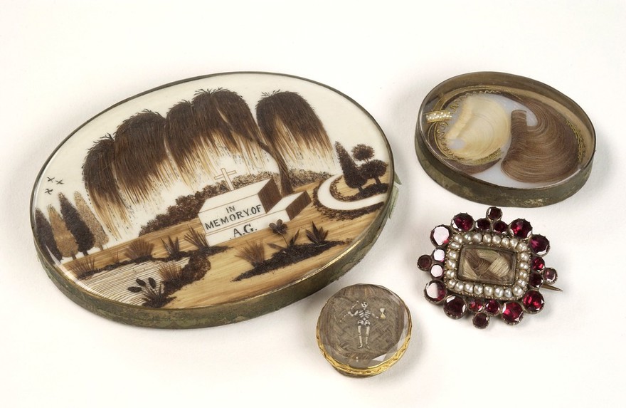 Mourning brooches containing the hair of a deceased relative.