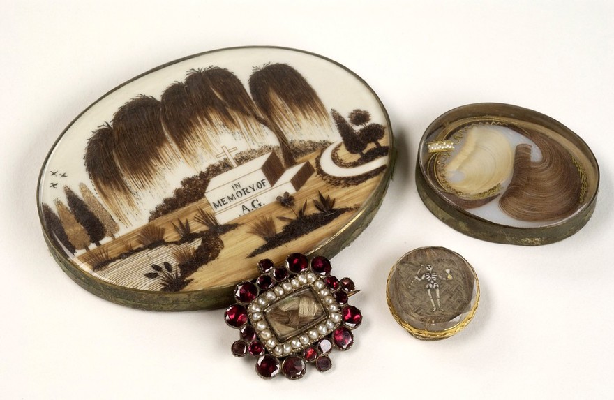 Mourning brooches containing the hair of a deceased relative.