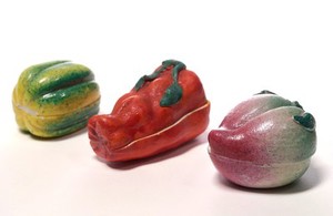 view Porcelain fruit containing couple engaged in sexual foreplay