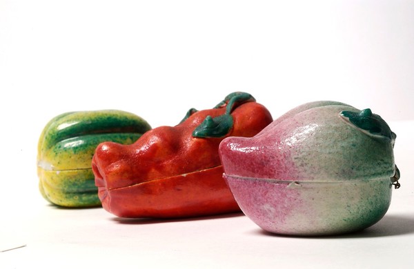 Porcelain fruit containing couple engaged in sexual foreplay