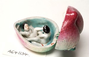 view Porcelain fruit containing couple engaged in sexual foreplay