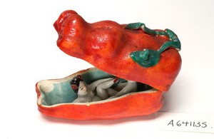 view Porcelain fruit containing couple engaged in sexual foreplay