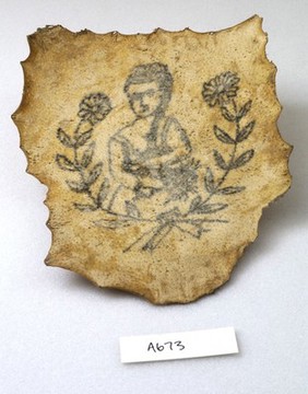 A tattoo on a piece of human skin showing a lady, possibly a lover, surrounded by a garland of flowers