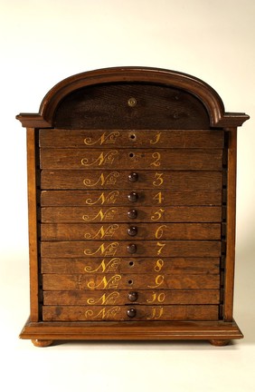 Oak metaria medica chest with drawers containing animal, vegetable and mineral specimens. Dutch.