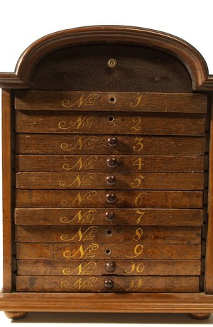 view Oak metaria medica chest with drawers containing animal, vegetable and mineral specimens. Dutch.