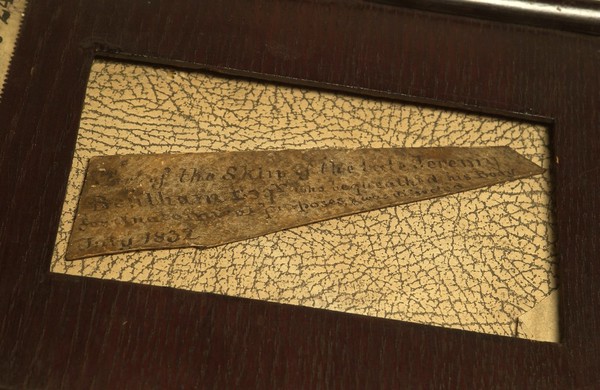 An inscription fragment of human skin, said to that of the philosopher Jeremy Bentham, dissected in London, 1832