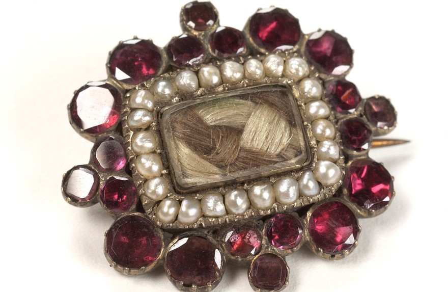 Mourning brooch containing the hair of a deceased relative.