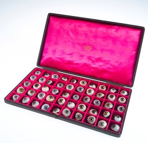 view A case filled with a selection of 50 glass eyes. Possibly made by E. Muller of Liverpool.