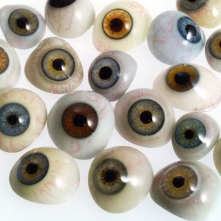 A selection of glass eyes from an opticians glas eye case. Possibly made by E. Muller of Liverpool.