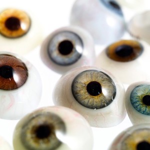 view A selection of glass eyes from an opticians glass eye case.