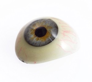 view A selection of glass eyes from an opticians glas eye case. Possibly made by E. Muller of Liverpool.