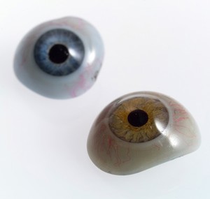 view A selection of glass eyes from an opticians glas eye case. Possibly made by E. Muller of Liverpool.