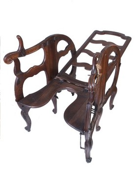 A foldable and adjustable birthing chair, made of walnut wood. European, late 17th or early 18th century