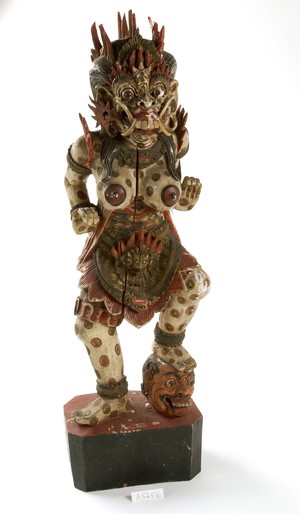 view Wooden figure of bare-breasted female demon