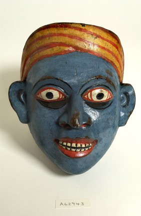 Sri Lankan mask. Blue face with stiped head-dress.