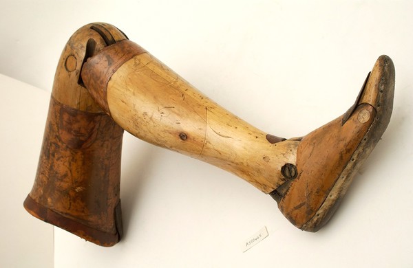 Artificial left leg with thigh socket for amputation above the knee.