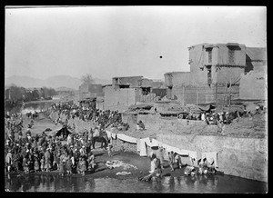 view View of the Kabul River to the North East. People wash and dry their laundry.